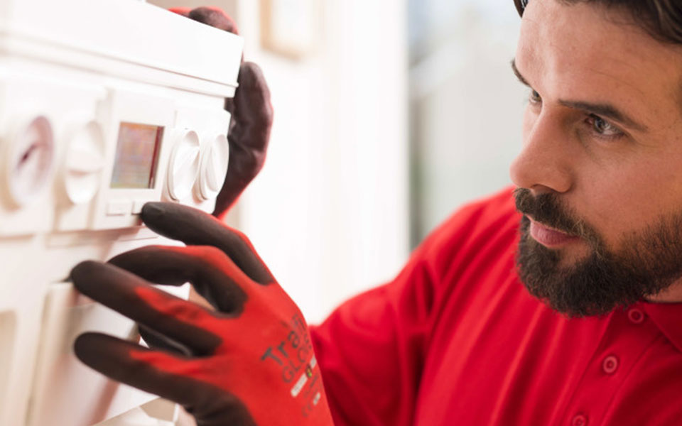 man working on wall unit